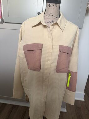 lululemon cream textured fabric with khaki and neon logo patch